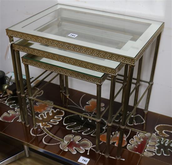 A nest of three mirror top brass occasional tables W.52cm